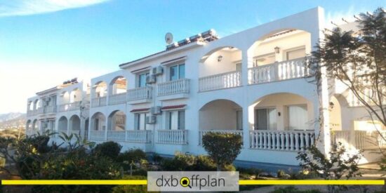 Exterior of Marina View Apartments with a balcony view of Esentepe's coastline.