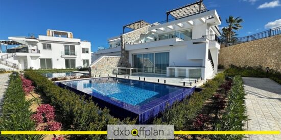 Poseidon Apartments’ landscaped garden area providing a serene setting with direct sea access.
